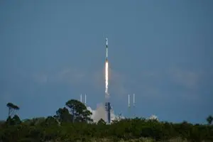 sending the capsule into space atop a Falcon 9 rocket