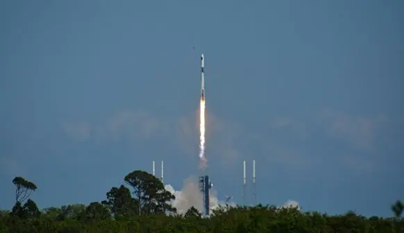 sending the capsule into space atop a Falcon 9 rocket