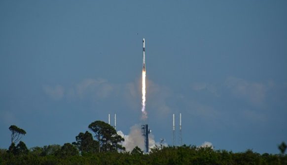 sending the capsule into space atop a Falcon 9 rocket